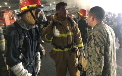 Firefighters from the greater San Diego area battle fire onboard the USS Bonhomme Richard (LHD-6)