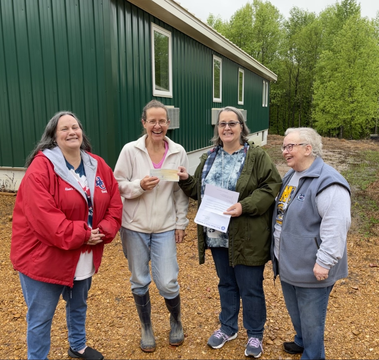 NWCA Presents National Project Donation Check to Darkhorse Lodge, Paris, TN on April 24, 2021.